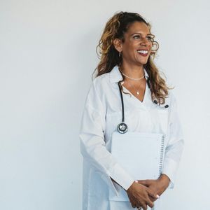 Portrait of yoga practitioner Sofia Kravchuk smiling confidently.