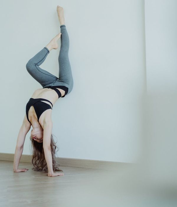 Woman performing a stable yoga posture for core strength and balance.